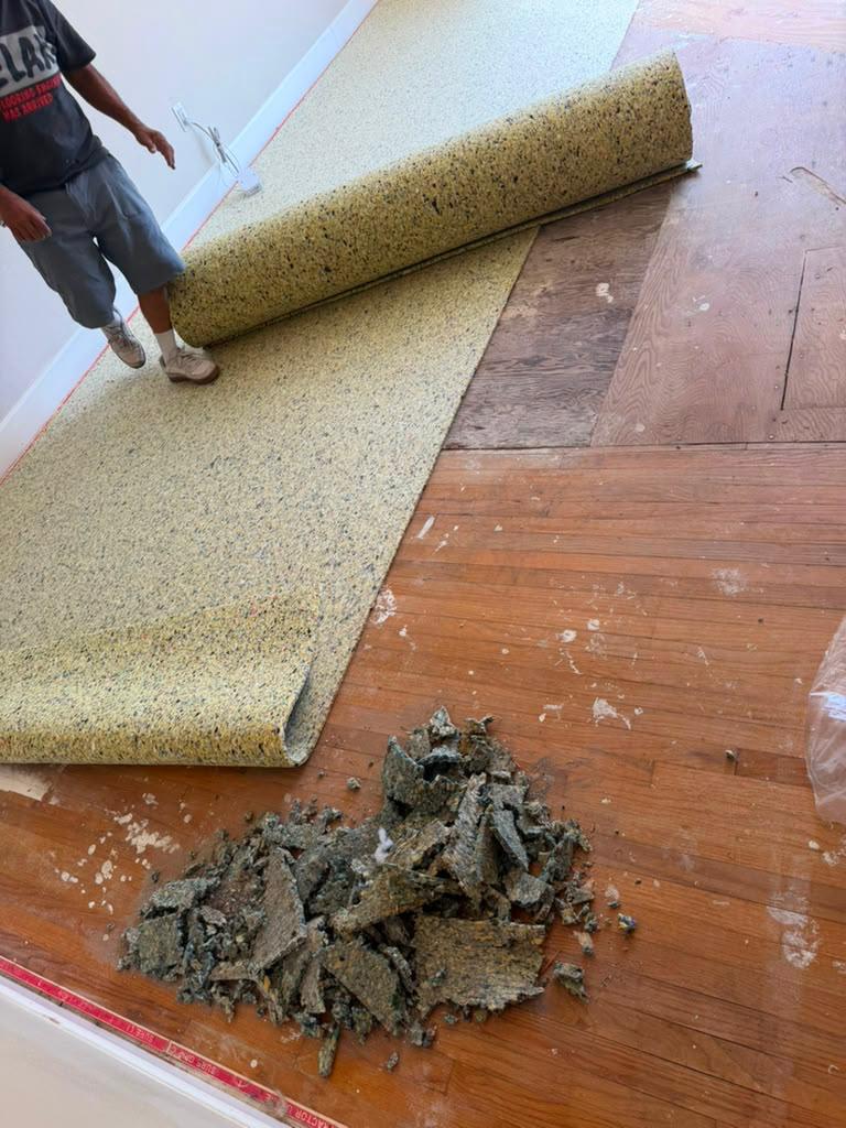 Old carpet padding removal before new carpet installation